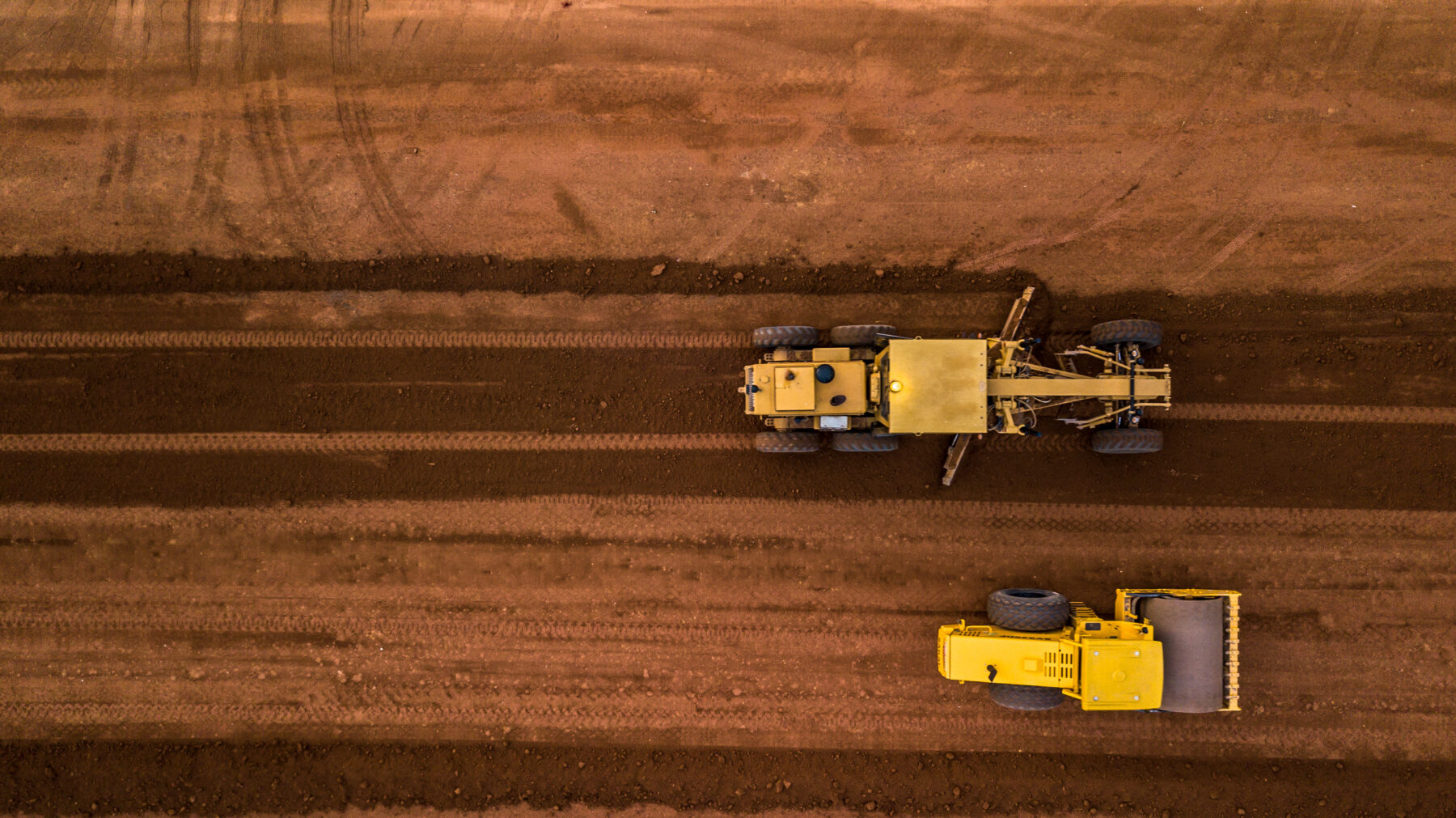Whether you're preparing land for roadways, commercial developments, or residential builds, our precision grading ensures optimal drainage, stability, and efficiency.